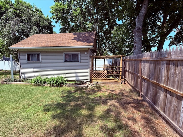 1016 Howells Rd, Bay Shore, NY 11706 - rear view of property featuring a fenced backyard and a shingled roof