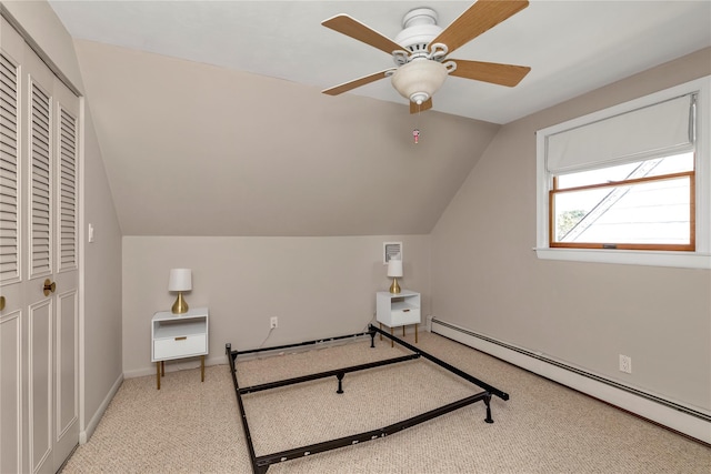 95 Falmouth Pl, Albertson, NY 11507 - bedroom featuring a baseboard radiator, lofted ceiling, light colored carpet, and ceiling fan