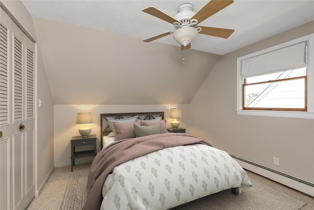 95 Falmouth Pl, Albertson, NY 11507 - bedroom featuring a baseboard heating unit, light colored carpet, vaulted ceiling, ceiling fan, and a closet