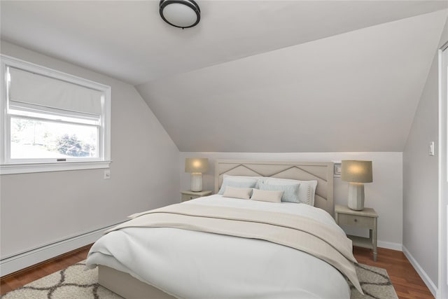 95 Falmouth Pl, Albertson, NY 11507 - bedroom featuring wood finished floors and vaulted ceiling