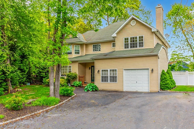 195 Bridle Way, Oakdale, NY 11769 - traditional-style home featuring a chimney, driveway, and a garage