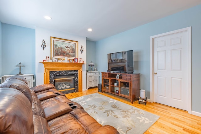 195 Bridle Way, Oakdale, NY 11769 - living area with light wood-style floors, recessed lighting, and a fireplace