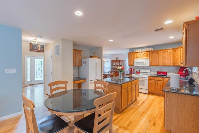 195 Bridle Way, Oakdale, NY 11769 - kitchen featuring white appliances, a kitchen island, light wood-style floors, backsplash, and recessed lighting