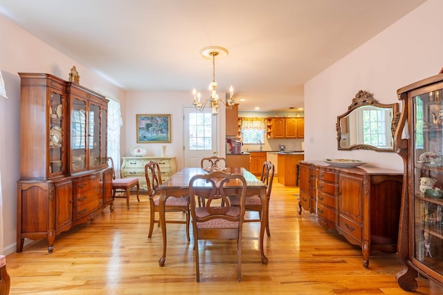 195 Bridle Way, Oakdale, NY 11769 - dining area with a chandelier and light wood finished floors