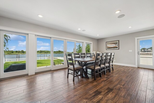 26 Island Pkwy N, Island Park, NY 11558 - dining area with dark wood finished floors, a water view, and recessed lighting