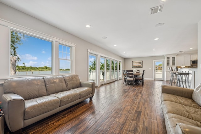 26 Island Pkwy N, Island Park, NY 11558 - living area with dark wood-style floors and recessed lighting