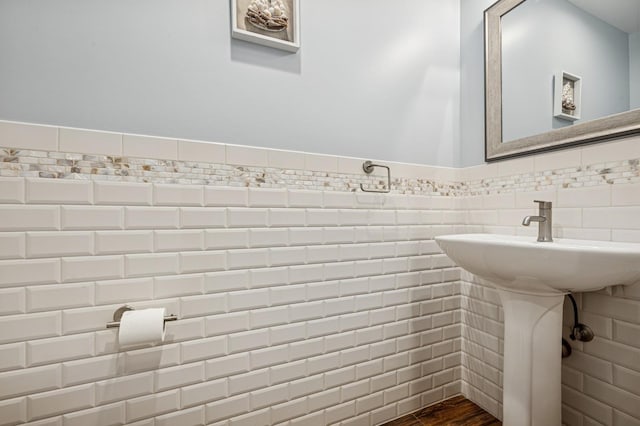 26 Island Pkwy N, Island Park, NY 11558 - bathroom featuring tile walls and wood finished floors