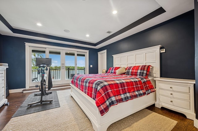 26 Island Pkwy N, Island Park, NY 11558 - bedroom with access to outside, french doors, a tray ceiling, dark wood finished floors, and recessed lighting