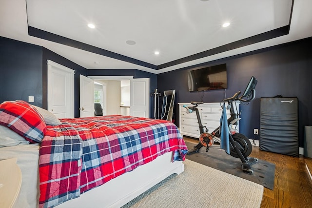 26 Island Pkwy N, Island Park, NY 11558 - bedroom featuring a raised ceiling, recessed lighting, and wood finished floors