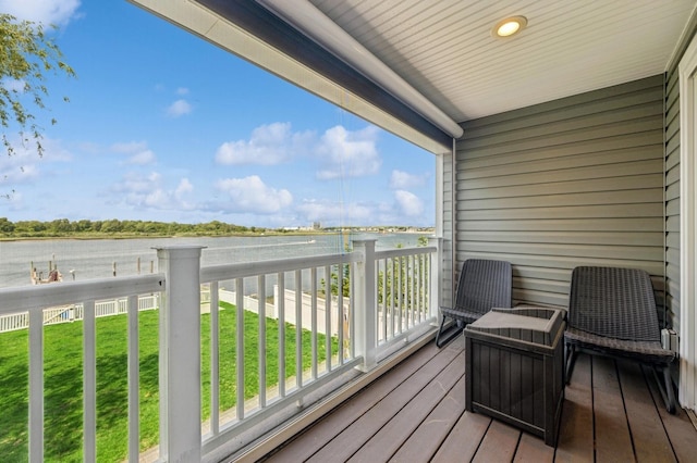 26 Island Pkwy N, Island Park, NY 11558 - deck featuring a water view and a lawn