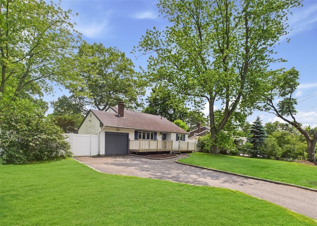 18 Huron St, Port Jefferson Station, NY 11776 - view of front of house with driveway, a garage, and a chimney