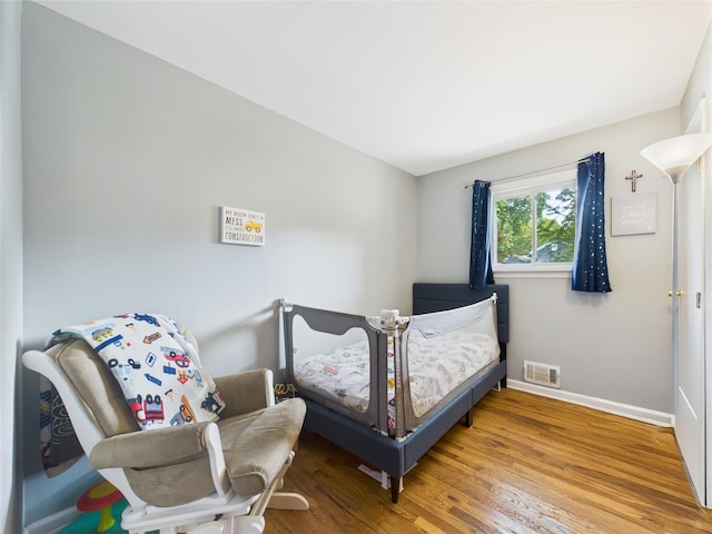 18 Huron St, Port Jefferson Station, NY 11776 - bedroom with baseboards and wood finished floors