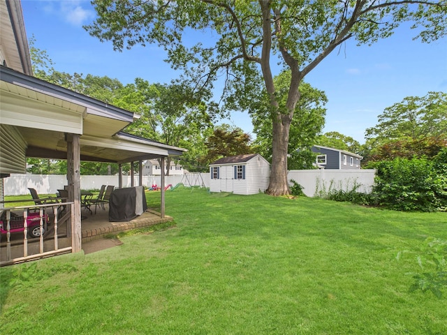 18 Huron St, Port Jefferson Station, NY 11776 - fenced backyard with a patio area and a storage unit