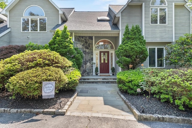 48 Orchard Hill Rd, Carmel, NY 10512 - tri-level home featuring a shingled roof and stone siding