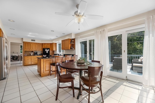 48 Orchard Hill Rd, Carmel, NY 10512 - dining space with healthy amount of natural light, light tile patterned flooring, a ceiling fan, and washing machine and clothes dryer