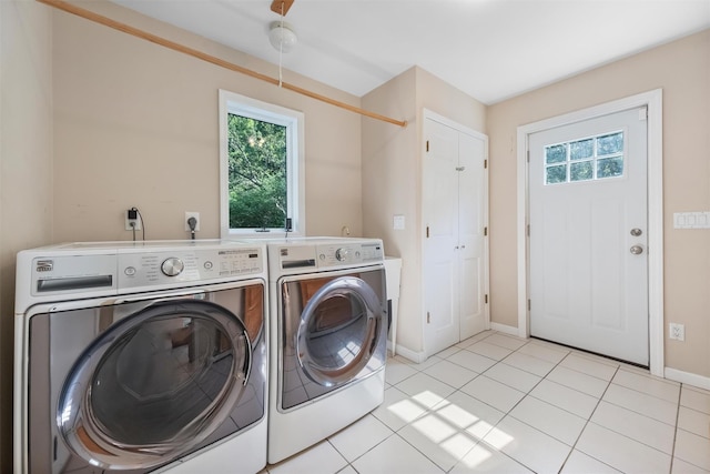 48 Orchard Hill Rd, Carmel, NY 10512 - washroom featuring washing machine and clothes dryer and light tile patterned floors