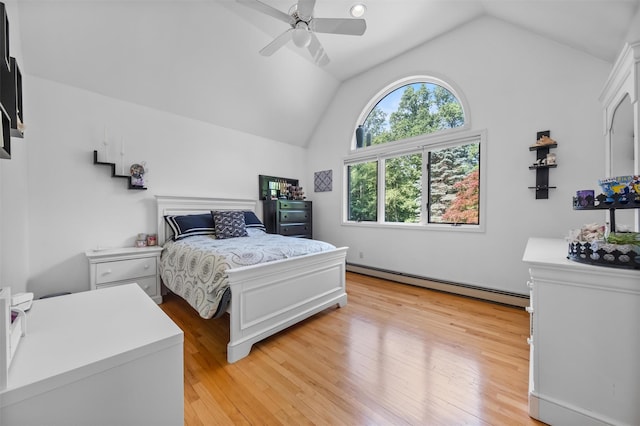 48 Orchard Hill Rd, Carmel, NY 10512 - bedroom with a baseboard heating unit, vaulted ceiling, light wood finished floors, and ceiling fan