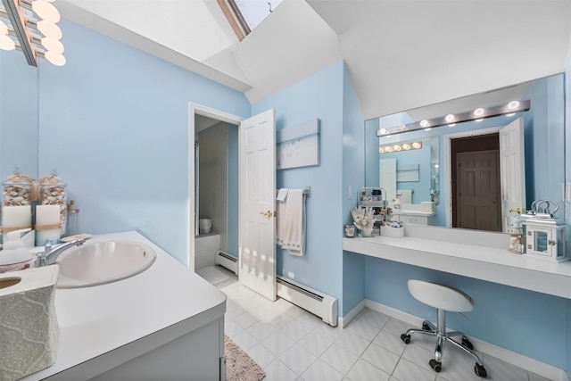 48 Orchard Hill Rd, Carmel, NY 10512 - bathroom featuring a baseboard heating unit, vanity, and vaulted ceiling