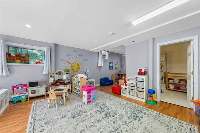 48 Orchard Hill Rd, Carmel, NY 10512 - playroom with light wood-style floors and recessed lighting