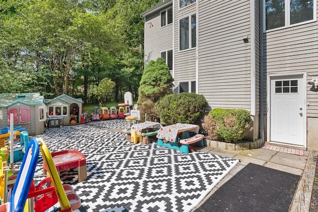 48 Orchard Hill Rd, Carmel, NY 10512 - view of patio featuring view of scattered trees and a storage shed