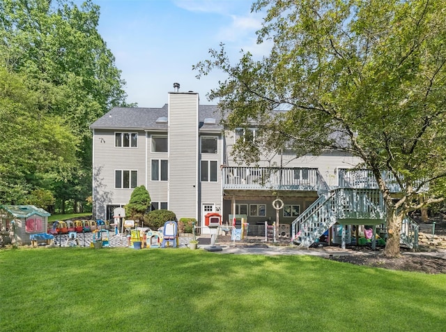 48 Orchard Hill Rd, Carmel, NY 10512 - rear view of property featuring a deck, stairs, a yard, and a chimney