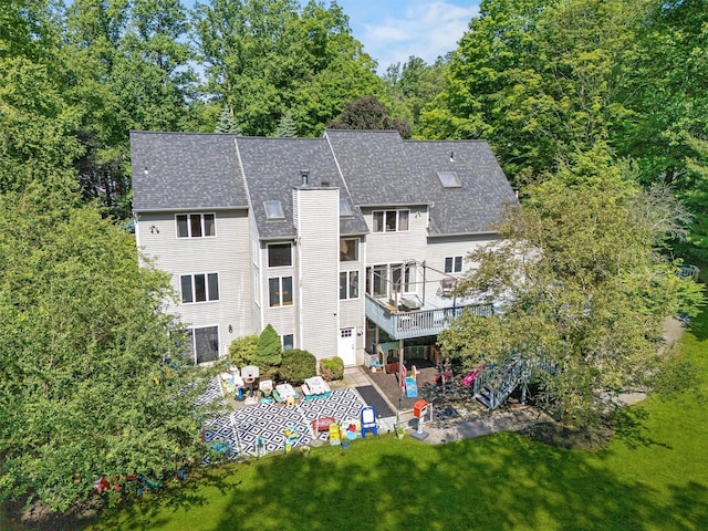 48 Orchard Hill Rd, Carmel, NY 10512 - rear view of house featuring a patio, roof with shingles, a yard, a deck, and a chimney