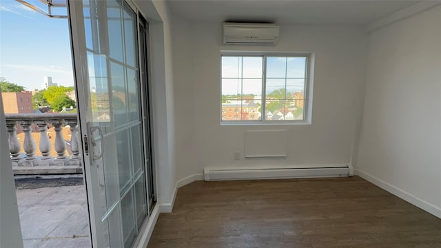 43-18 Robinson Unit 7C, Flushing, NY 11355 - spare room with a wall mounted AC, baseboard heating, and wood finished floors