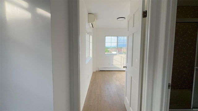 43-18 Robinson Unit 7C, Flushing, NY 11355 - hall featuring a baseboard heating unit, light wood-type flooring, and a wall mounted AC