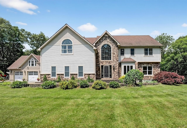 2300 State Route 207, Rock Tavern, NY 12575 - view of front of home featuring stone siding, a front lawn, and a garage