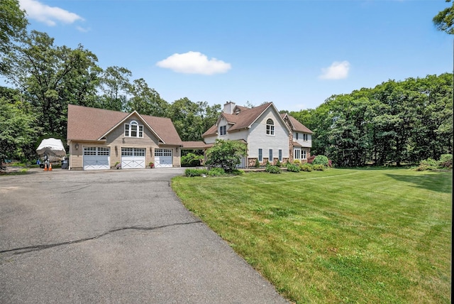 2300 State Route 207, Rock Tavern, NY 12575 - view of front of property featuring a front lawn, asphalt driveway, and a chimney