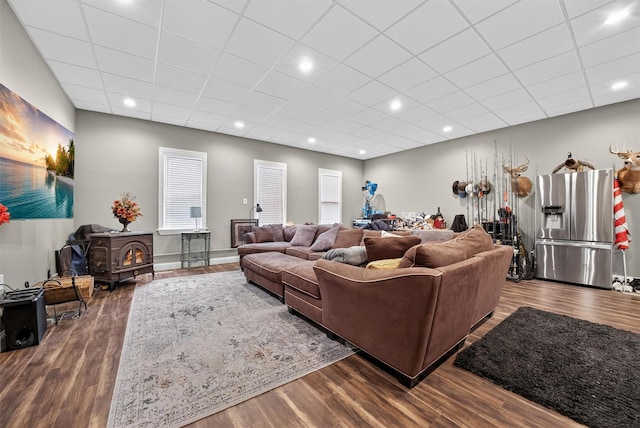2300 State Route 207, Rock Tavern, NY 12575 - living room with a wood stove, wood finished floors, and a paneled ceiling