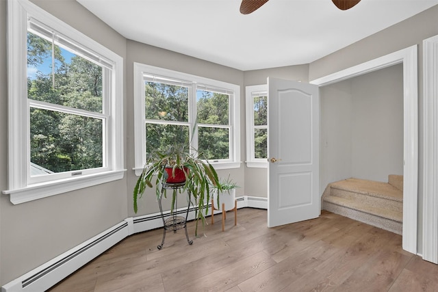 2300 State Route 207, Rock Tavern, NY 12575 - living area with baseboard heating, ceiling fan, plenty of natural light, and light wood-style flooring