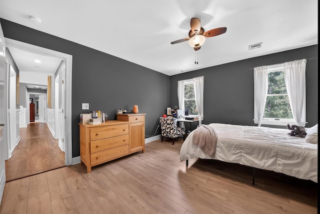 2300 State Route 207, Rock Tavern, NY 12575 - bedroom featuring light wood-type flooring, a ceiling fan, and an office area
