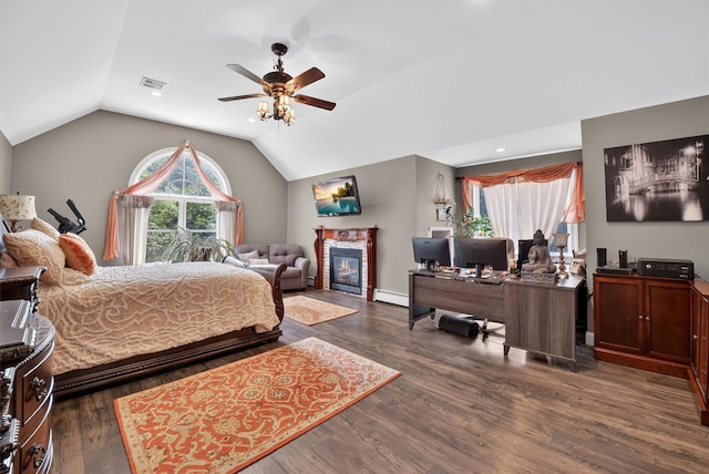 2300 State Route 207, Rock Tavern, NY 12575 - bedroom featuring a baseboard heating unit, a glass covered fireplace, vaulted ceiling, an office area, and dark wood-style floors
