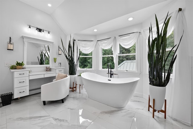 2300 State Route 207, Rock Tavern, NY 12575 - bathroom with a freestanding tub, vanity, vaulted ceiling, marble tiled flooring, and recessed lighting