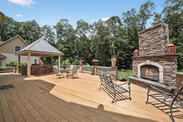 2300 State Route 207, Rock Tavern, NY 12575 - wooden deck featuring an outdoor stone fireplace, outdoor dining area, and a gazebo