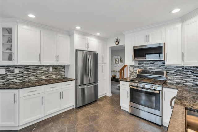 185 Harvard Dr, Plainview, NY 11803 - kitchen featuring appliances with stainless steel finishes, white cabinetry, decorative backsplash, and recessed lighting