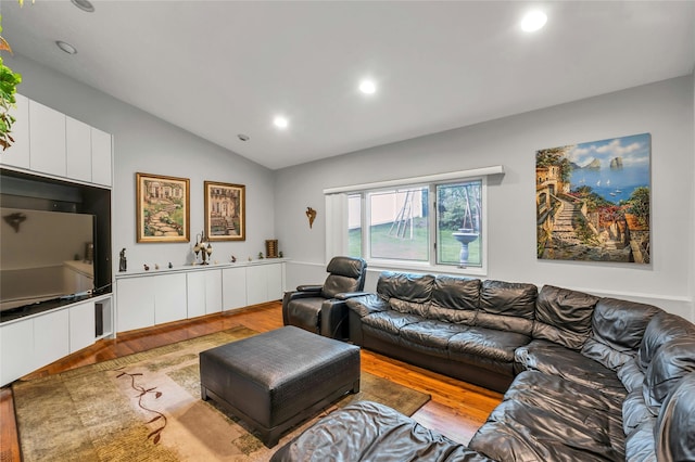 185 Harvard Dr, Plainview, NY 11803 - living area featuring wood finished floors, lofted ceiling, and recessed lighting
