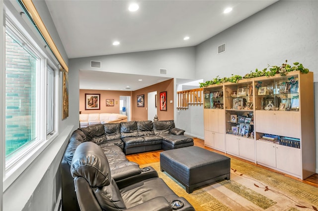 185 Harvard Dr, Plainview, NY 11803 - living area featuring wood finished floors, recessed lighting, and high vaulted ceiling