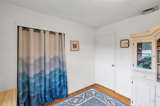 185 Harvard Dr, Plainview, NY 11803 - spare room with wood finished floors and baseboards