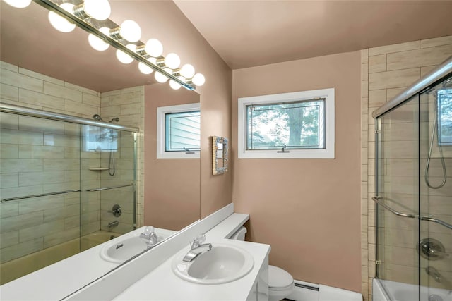 185 Harvard Dr, Plainview, NY 11803 - bathroom with healthy amount of natural light, enclosed tub / shower combo, and a baseboard heating unit