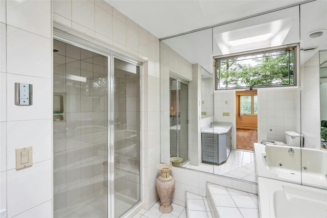 185 Harvard Dr, Plainview, NY 11803 - bathroom featuring tile walls, tile patterned floors, vanity, a tub with jets, and a stall shower