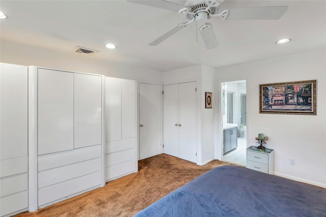 185 Harvard Dr, Plainview, NY 11803 - bedroom featuring carpet, two closets, recessed lighting, connected bathroom, and a ceiling fan