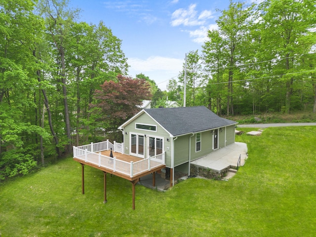 13 Ripley Rd, Patterson, NY 12563 - back of property with a deck, a yard, and roof with shingles