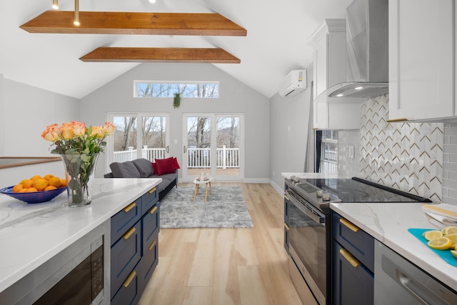13 Ripley Rd, Patterson, NY 12563 - kitchen featuring stainless steel appliances, wall chimney range hood, a wall unit AC, blue cabinets, and tasteful backsplash