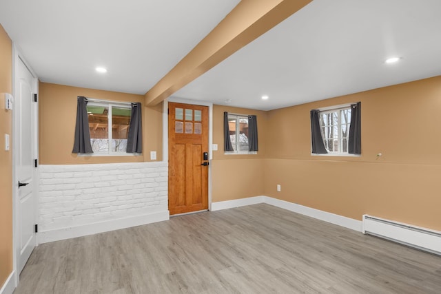 13 Ripley Rd, Patterson, NY 12563 - entrance foyer with baseboard heating, wood finished floors, recessed lighting, and brick wall