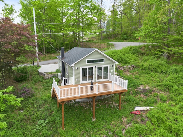 13 Ripley Rd, Patterson, NY 12563 - rear view of house with a deck, a chimney, and roof with shingles