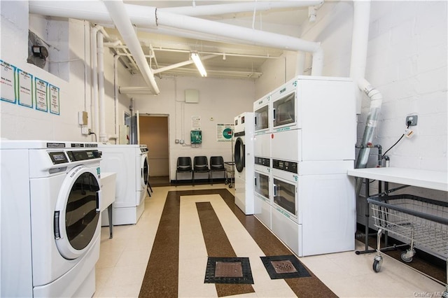 1133 Midland Ave Unit 4C, Bronxville, NY 10708 - community laundry room with stacked washer / dryer, separate washer and dryer, and concrete block wall
