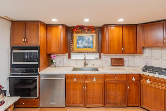 65 Berkshire Trl, Smallwood, NY 12720 - kitchen with stainless steel appliances, light countertops, brown cabinetry, backsplash, and recessed lighting