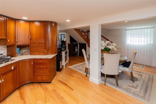65 Berkshire Trl, Smallwood, NY 12720 - kitchen with brown cabinetry, light countertops, light wood-style floors, and recessed lighting